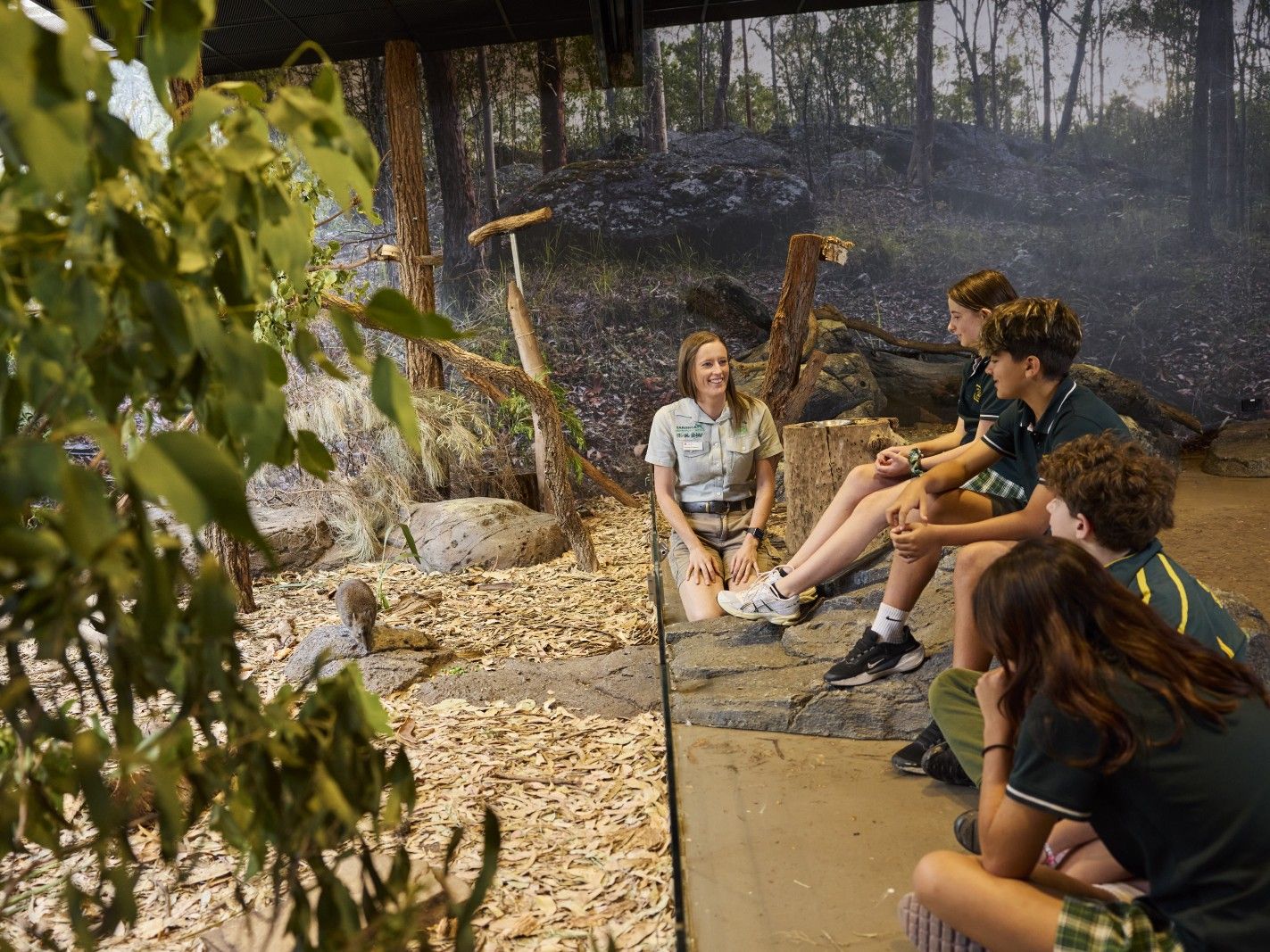 Taronga educator in bushland habitat classroom with school kids teaching them about Potoroos